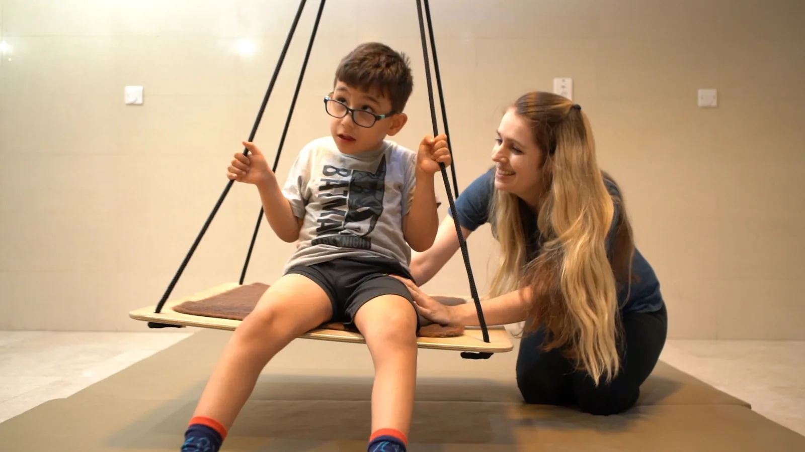 A child on a therapy swing at Hope